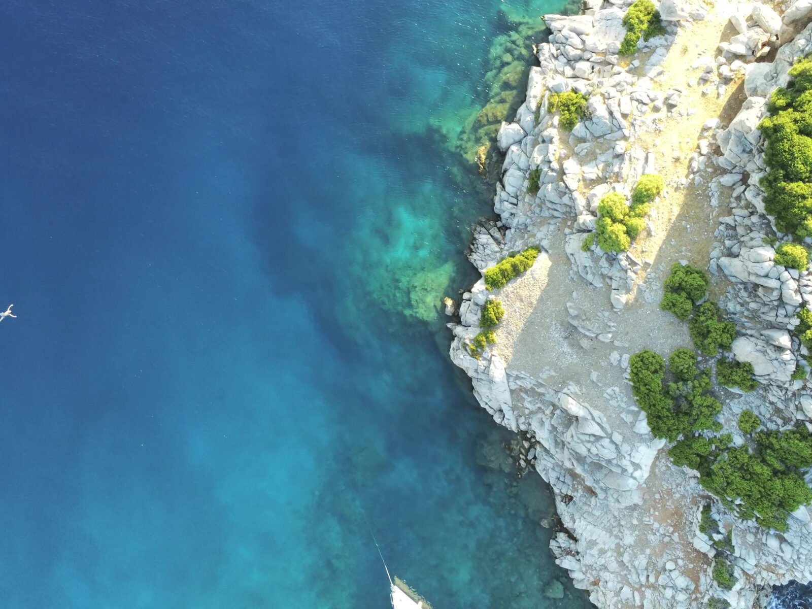 Aerial,View,Of,A,Lonely,Person,Swimming,Around,Dokos,Island