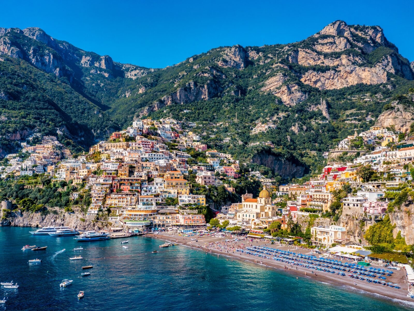 Aerial,View,Of,Positano,With,Comfortable,Beach,And,Blue,Sea