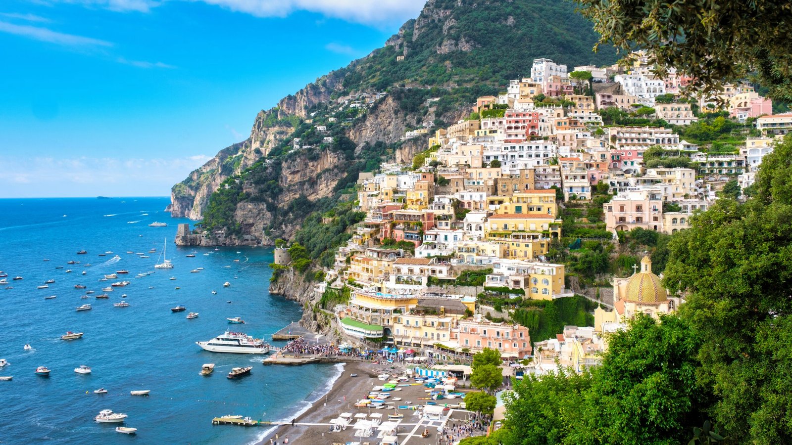 Vibrant,Houses,Cling,To,Cliff,Edges,In,Positano,Italy,,Overlooking