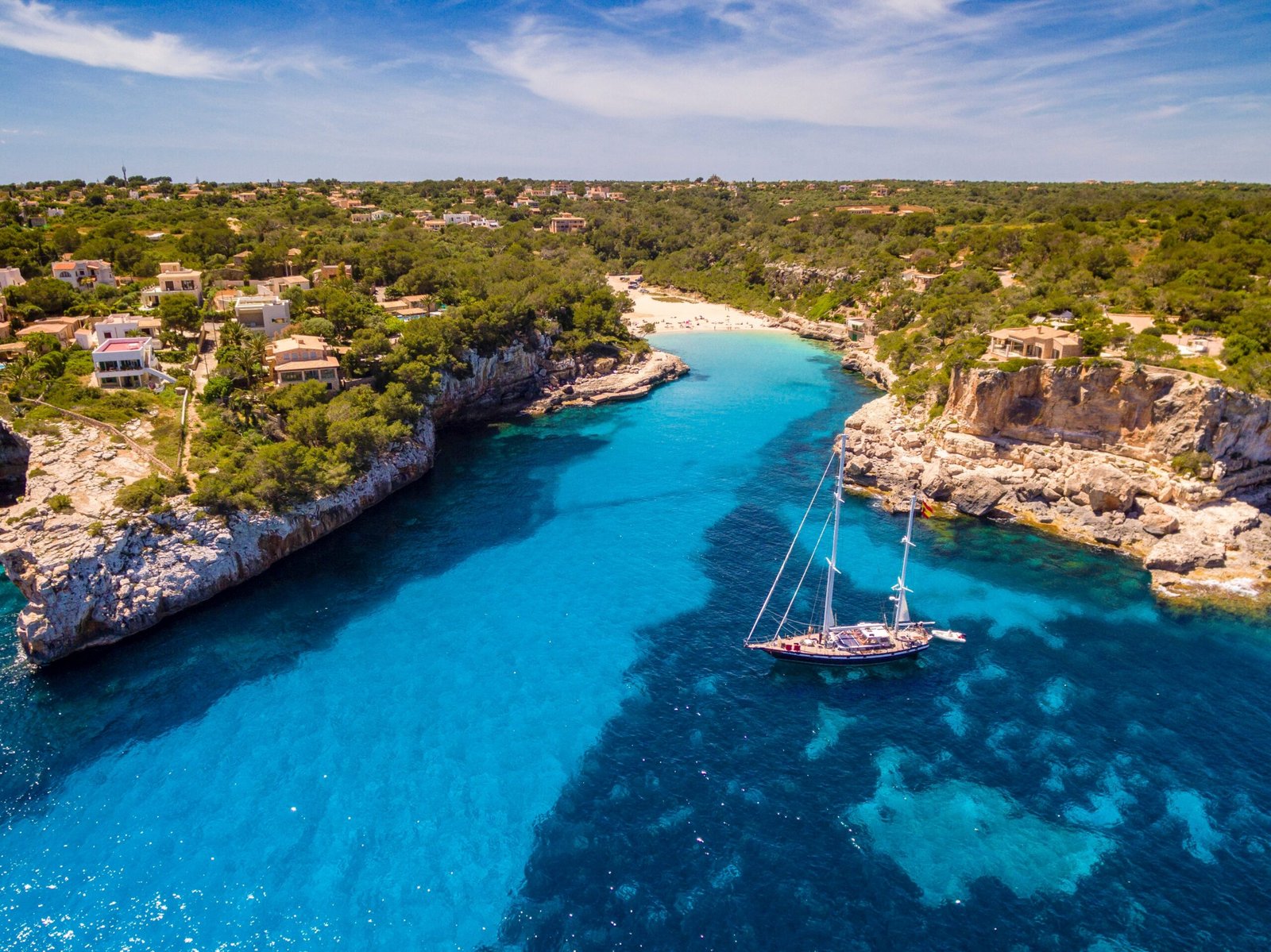Sailboat,Anchored,In,Front,Of,Cala,Llombards,,Santanyí,,Mallorca,,Balearic